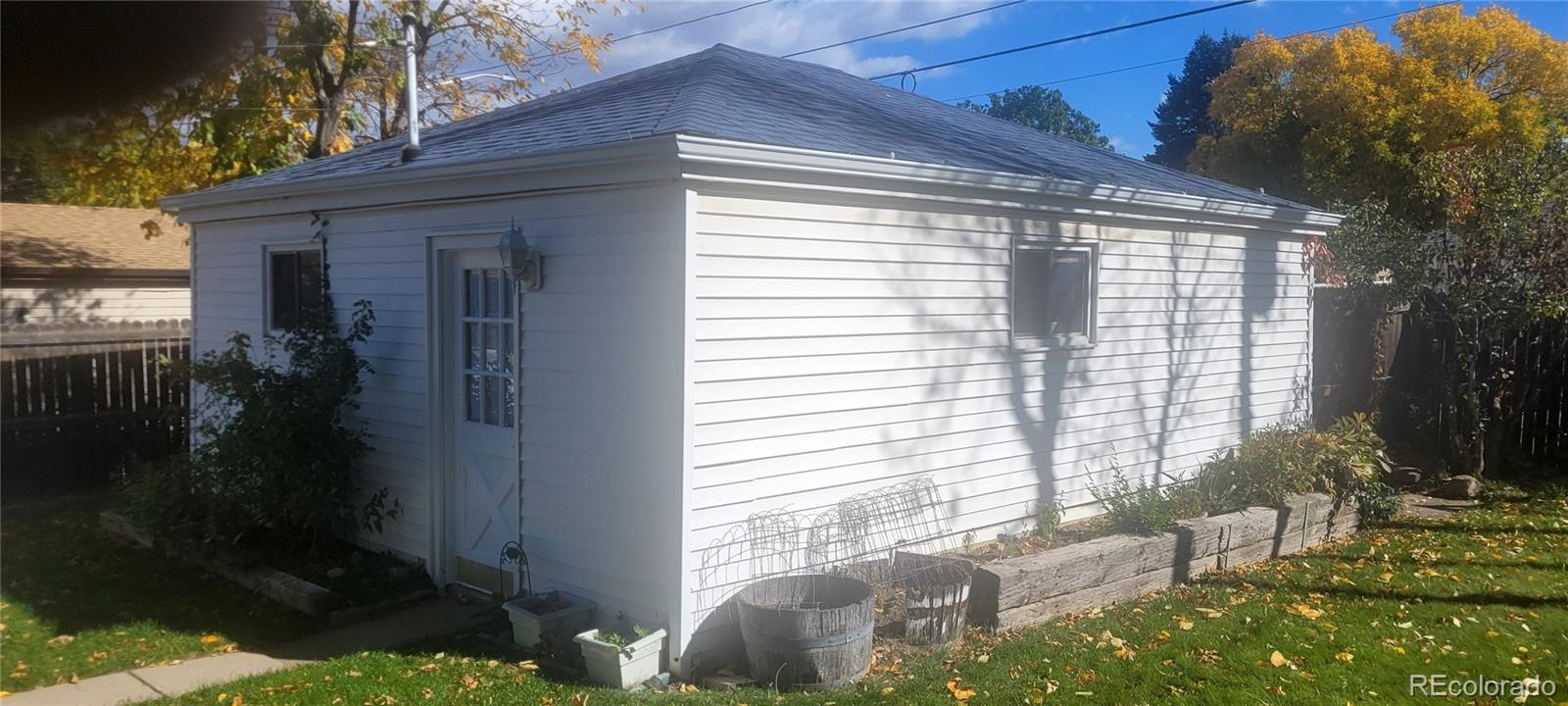 3450 Benton Street Wheat Ridge, CO 80212 - Photo 15 of 20 a front view of a house with a yard