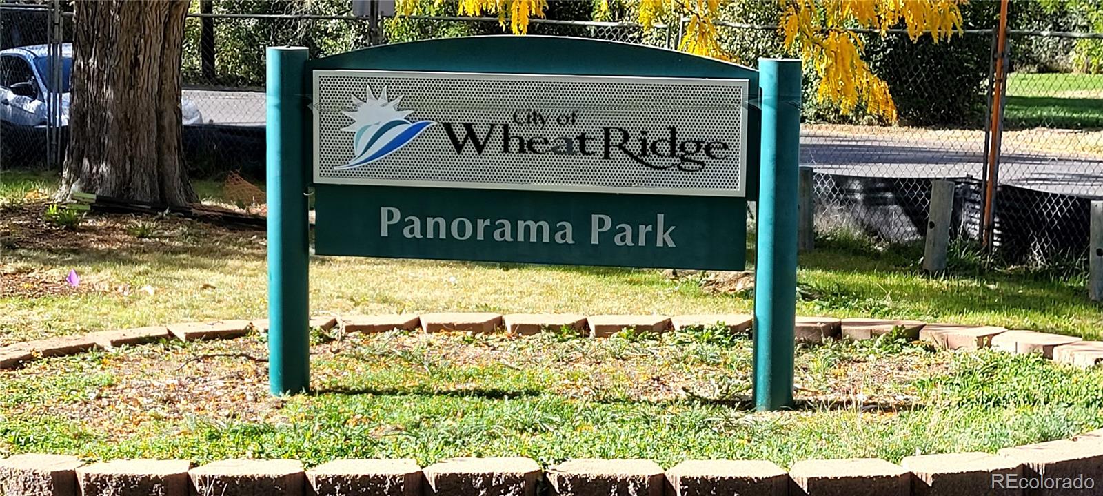 3450 Benton Street Wheat Ridge, CO 80212 - Photo 16 of 20 a sign broad on the side of the road