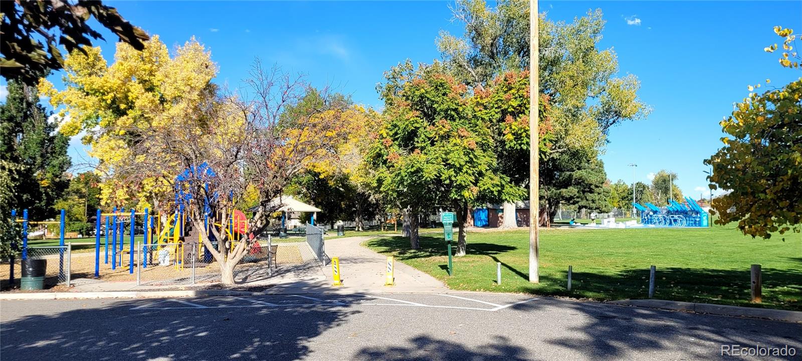 3450 Benton Street Wheat Ridge, CO 80212 - Photo 18 of 20 a view of a park with large trees