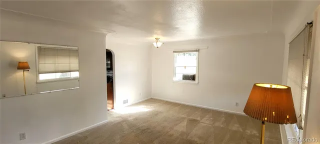 a view of an empty room and window