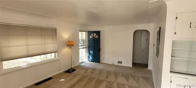 a view of room with window and ceiling fan