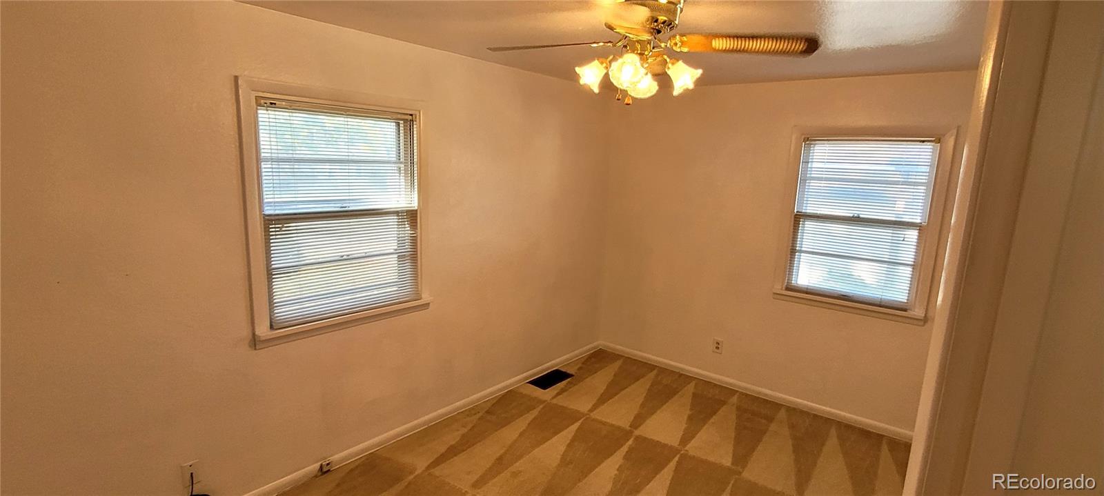 3450 Benton Street Wheat Ridge, CO 80212 - Photo 4 of 20 a view of room with window and ceiling fan
