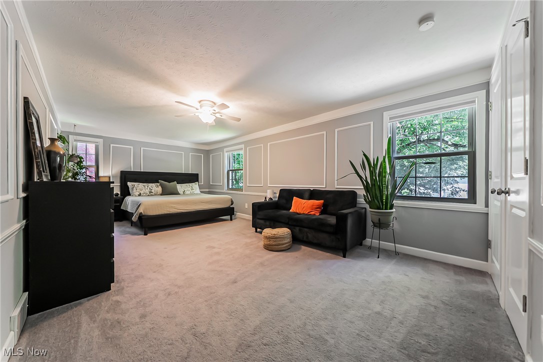 3684 Fenley Road Cleveland Heights, OH 44121 - Photo 13 of 38 Bedroom with carpet flooring, a decorative wall, a textured ceiling, and a ceiling fan