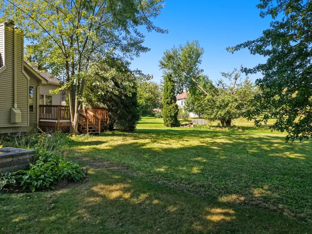 an aerial view of a house with a yard and garden
