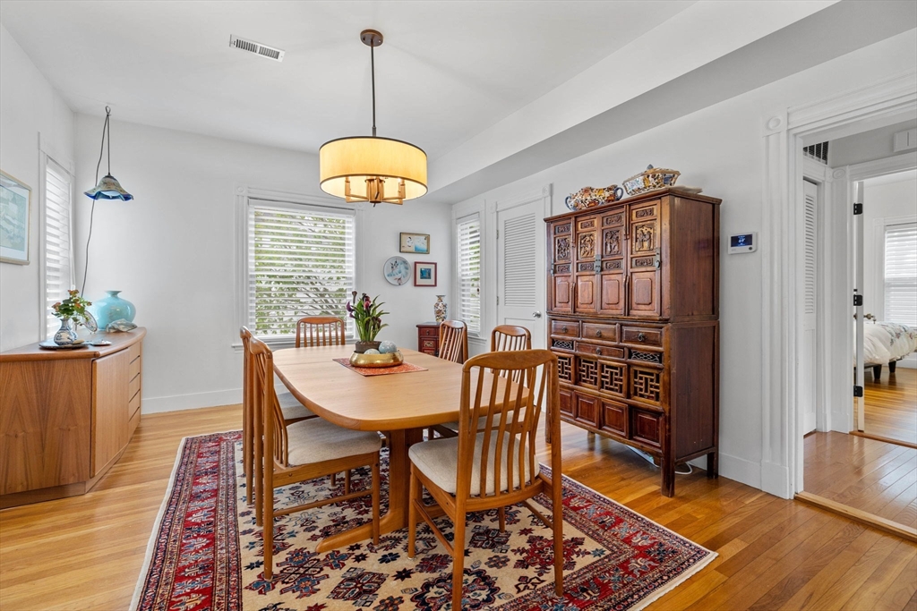 228 Langley Road Newton, MA 02459 - Photo 11 of 39 a view of a dining room with furniture