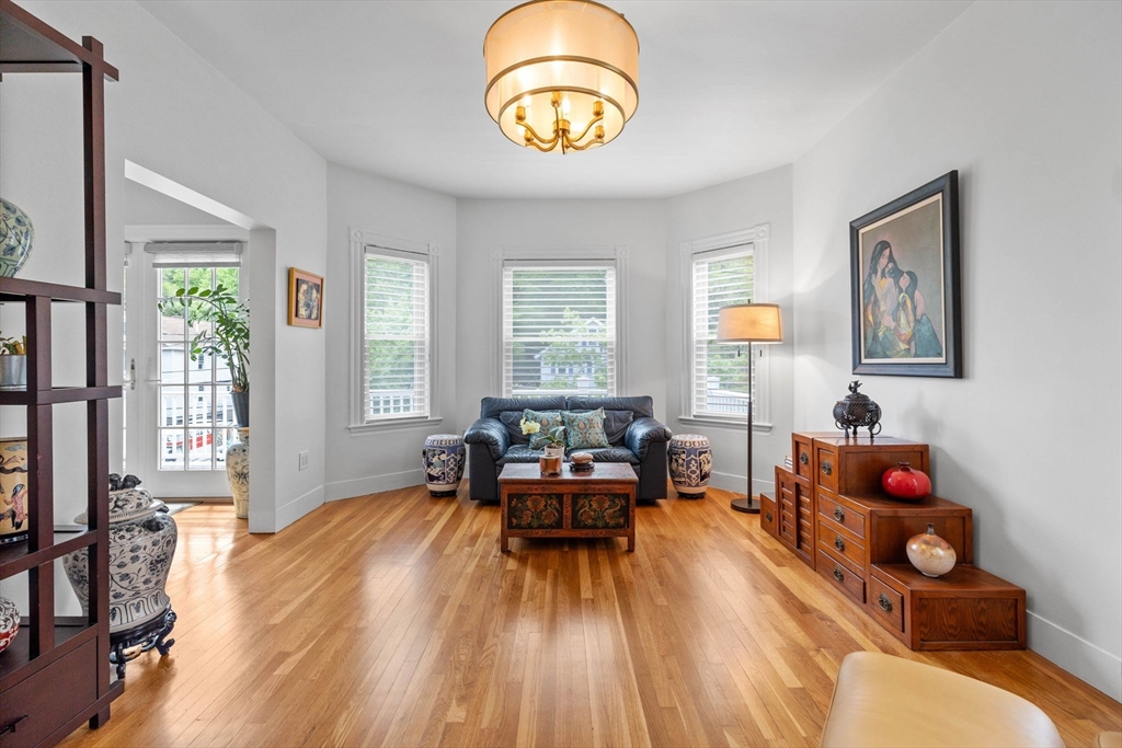 228 Langley Road Newton, MA 02459 - Photo 13 of 39 a living room with furniture and wooden floor