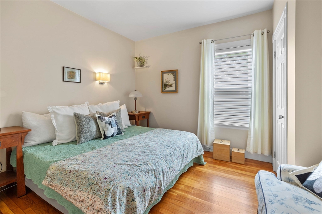 228 Langley Road Newton, MA 02459 - Photo 18 of 39 a bedroom with a bed and a couch