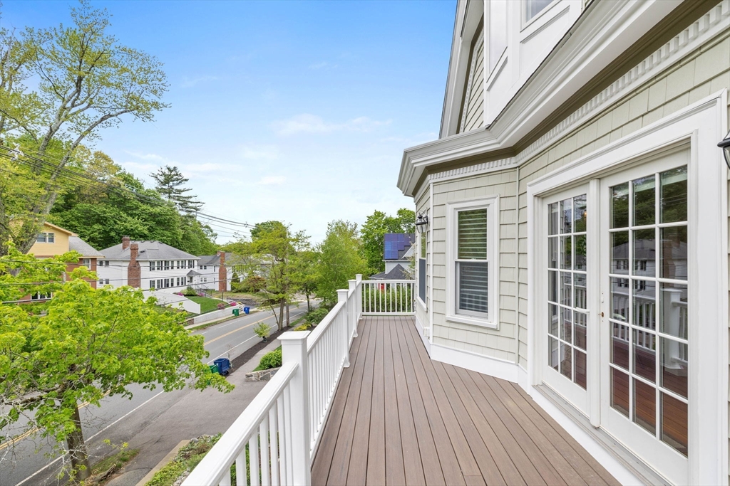 228 Langley Road Newton, MA 02459 - Photo 22 of 39 a view of a house with wooden deck