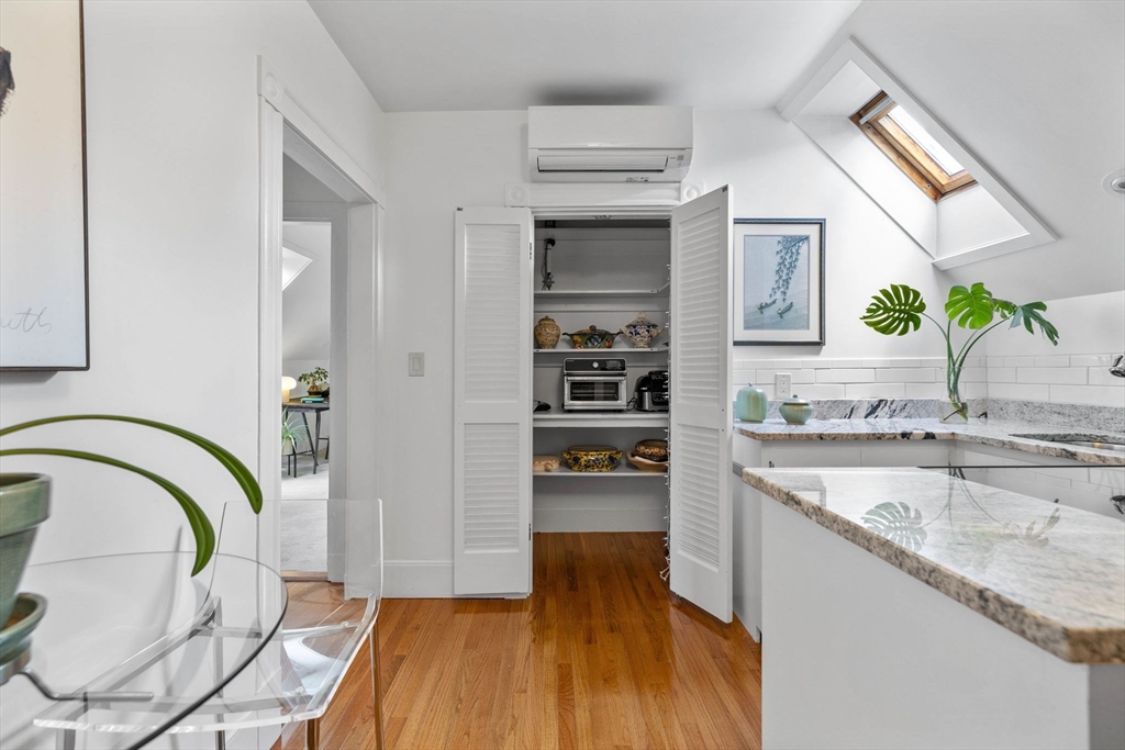 228 Langley Road Newton, MA 02459 - Photo 27 of 39 a kitchen with granite countertop a stove a sink and a refrigerator