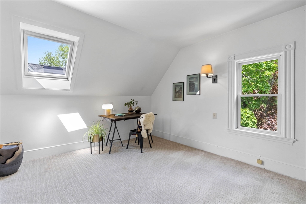 228 Langley Road Newton, MA 02459 - Photo 30 of 39 a view of a livingroom with furniture and a window