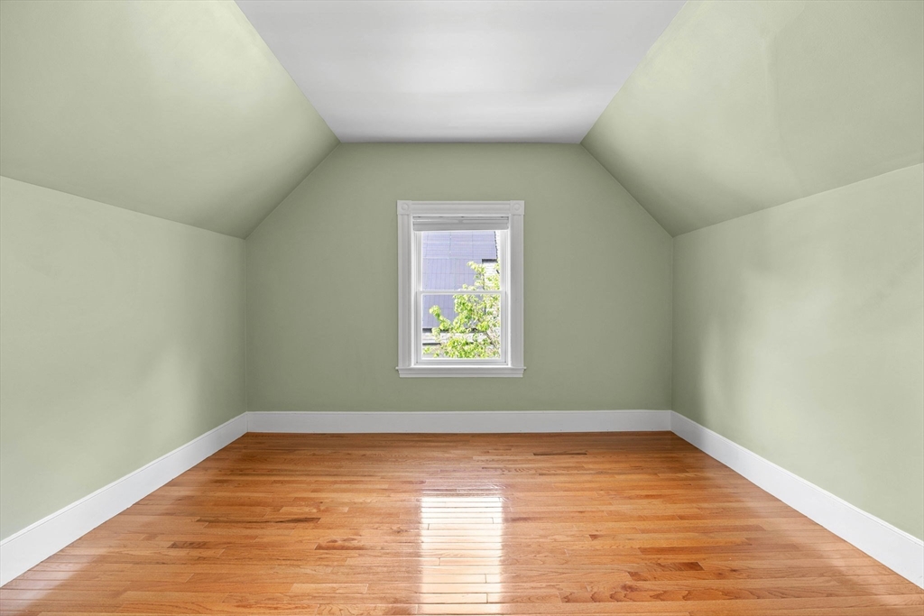 228 Langley Road Newton, MA 02459 - Photo 32 of 39 a view of room with window and wooden floor