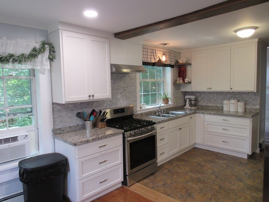 18 Blandford Hill Road Huntington, MA 01050 - Photo 11 of 33 a kitchen with granite countertop cabinets stainless steel appliances a sink and a window