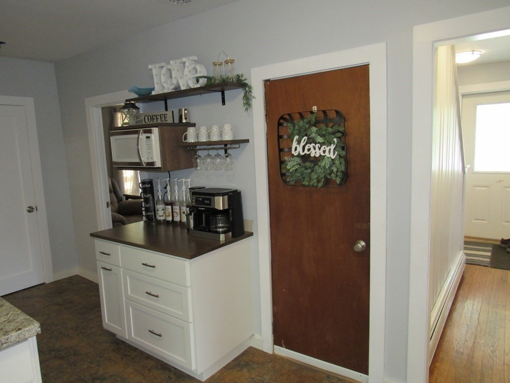 18 Blandford Hill Road Huntington, MA 01050 - Photo 13 of 33 a kitchen with white cabinets and window