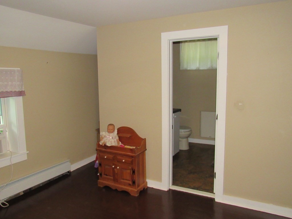 18 Blandford Hill Road Huntington, MA 01050 - Photo 19 of 33 an empty room with wooden floor and a window