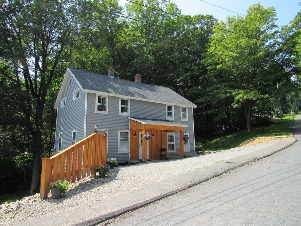 18 Blandford Hill Road Huntington, MA 01050 - Photo 2 of 33 front view of house with a yard