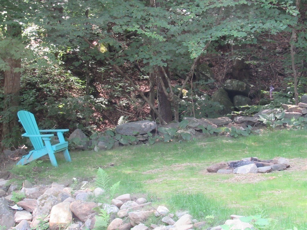 18 Blandford Hill Road Huntington, MA 01050 - Photo 25 of 33 a backyard of a house with table and chairs