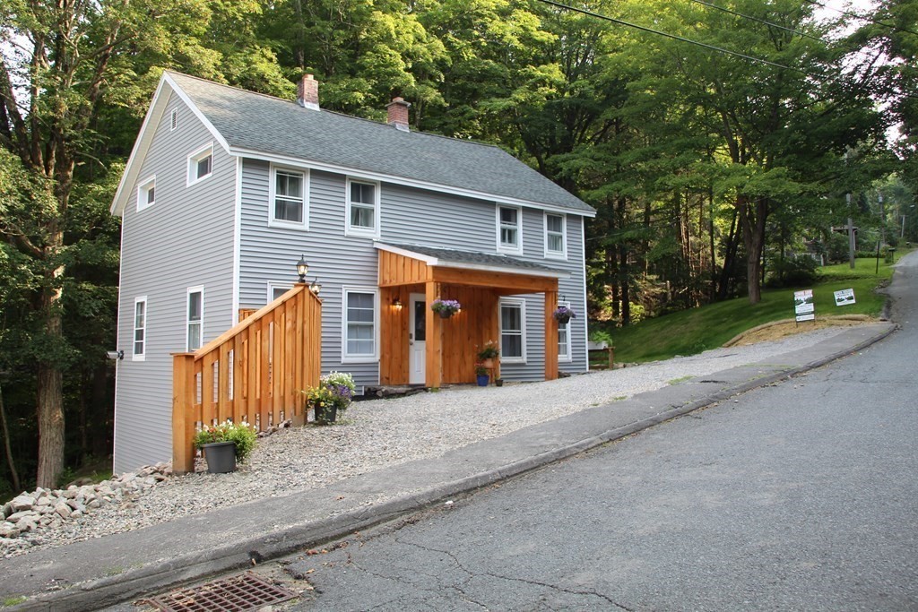 18 Blandford Hill Road Huntington, MA 01050 - Photo 32 of 33 a view of a house with a yard and large tree