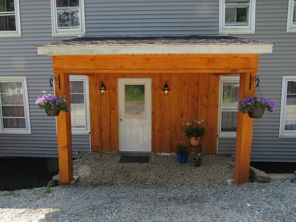 18 Blandford Hill Road Huntington, MA 01050 - Photo 4 of 33 a view of a house with a door