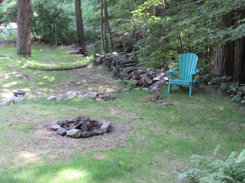 18 Blandford Hill Road Huntington, MA 01050 - Photo 6 of 33 a view of a backyard with plants and outdoor seating