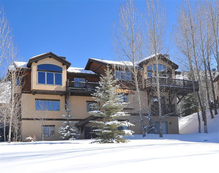 83 Knudson Ranch Road Edwards, CO 81632 - Photo 2 of 21 a front view of a house with a yard