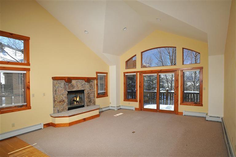 83 Knudson Ranch Road Edwards, CO 81632 - Photo 3 of 21 a living room with fireplace furniture and a window