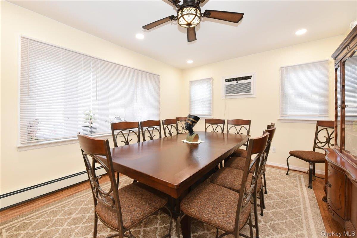 19 Sprague Drive Valley Stream, NY 11580 - Photo 11 of 30 a view of a dining room with furniture and wooden floor