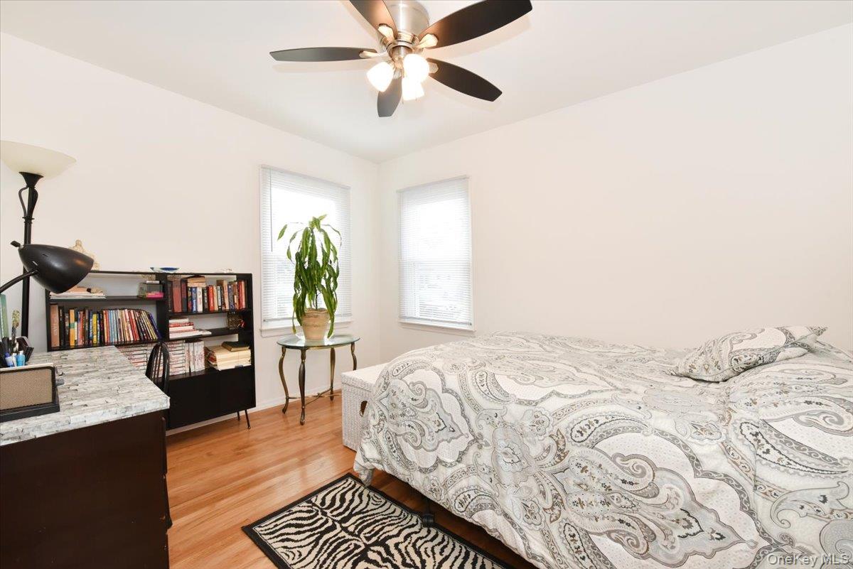 19 Sprague Drive Valley Stream, NY 11580 - Photo 17 of 30 a bedroom with bed and wooden floor