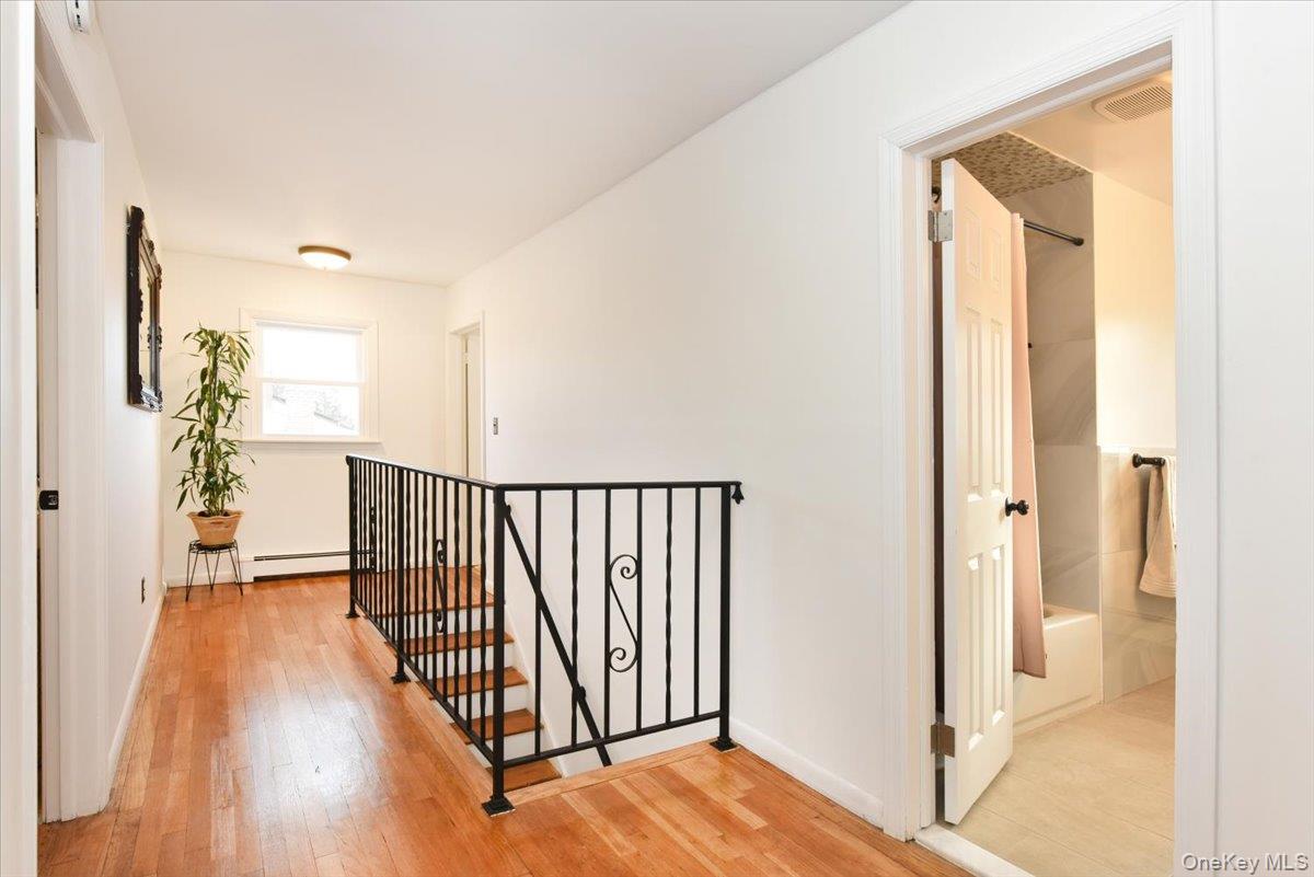 19 Sprague Drive Valley Stream, NY 11580 - Photo 19 of 30 a view of a hallway with wooden floor and entryway