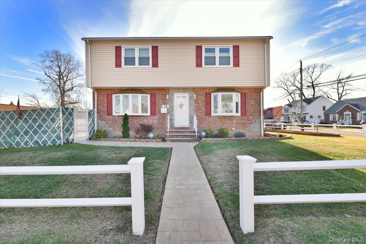 19 Sprague Drive Valley Stream, NY 11580 - Photo 2 of 30 a front view of a house with a yard