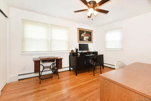 a workspace with furniture and window