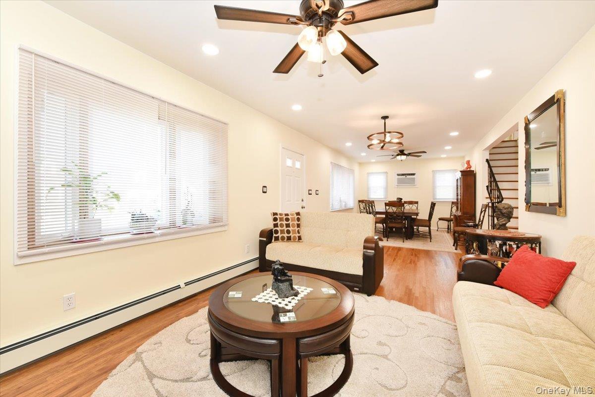 19 Sprague Drive Valley Stream, NY 11580 - Photo 9 of 30 a living room with furniture and a large window