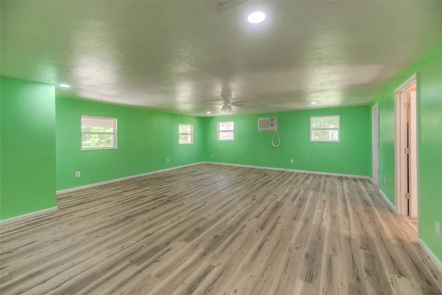 a view of empty room with window and stairs