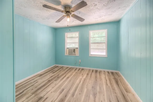 wooden floor in a room next to a window