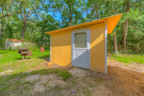 a backyard of a house with seating space