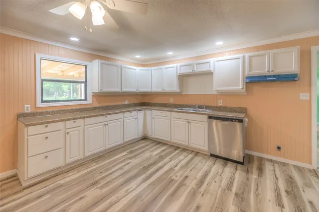 a kitchen with granite countertop white cabinets and white appliances