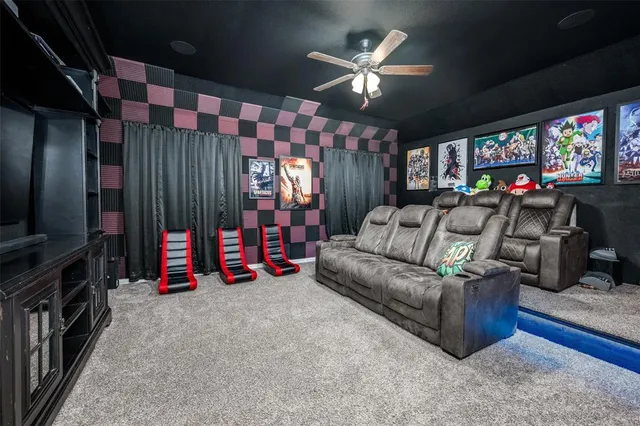 a living room with furniture a flat screen tv and a chandelier
