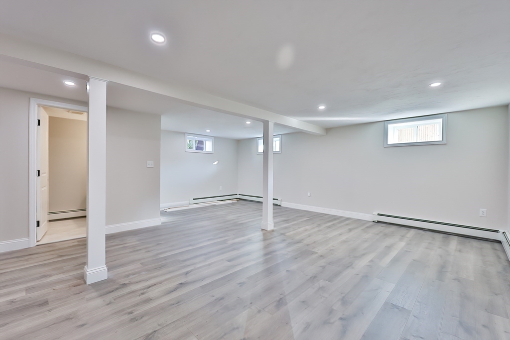 8 Dianthus Road Holbrook, MA 02343 - Photo 12 of 20 a view of an empty room with wooden floor