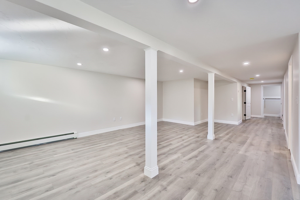 8 Dianthus Road Holbrook, MA 02343 - Photo 13 of 20 a view of an empty room with wooden floor