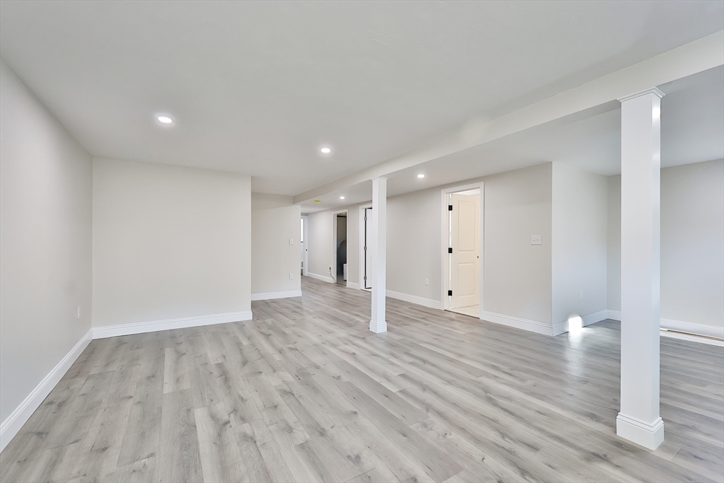 8 Dianthus Road Holbrook, MA 02343 - Photo 14 of 20 a view of an empty room with wooden floor