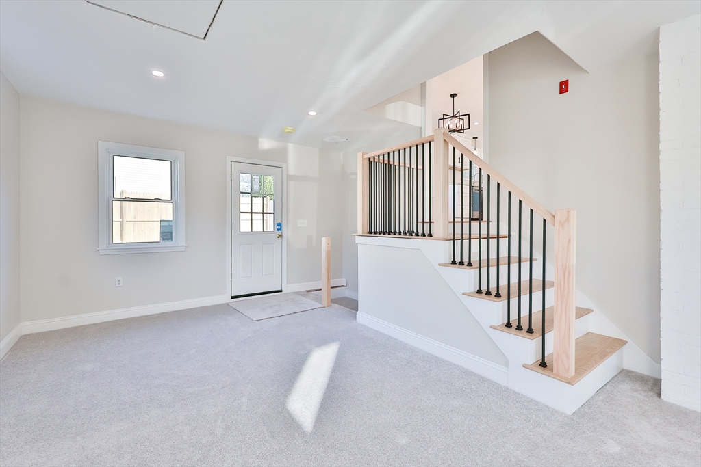 8 Dianthus Road Holbrook, MA 02343 - Photo 19 of 20 a view of livingroom with stairs and a window