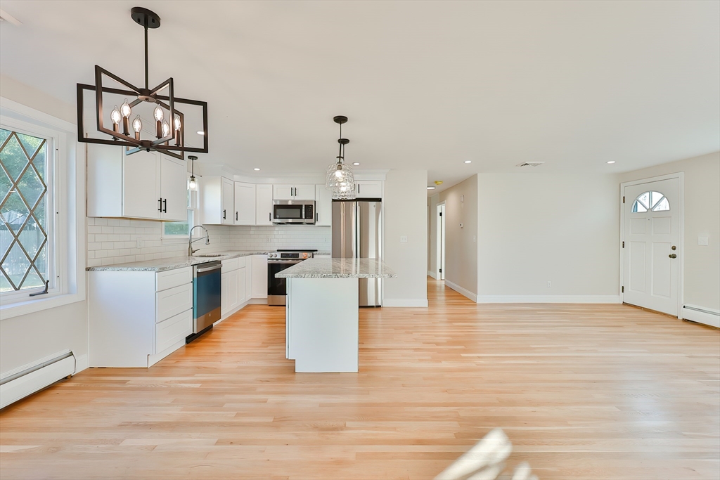 8 Dianthus Road Holbrook, MA 02343 - Photo 5 of 20 a view of a kitchen and an empty room