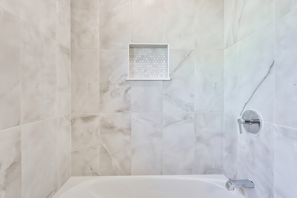 8 Dianthus Road Holbrook, MA 02343 - Photo 8 of 20 a bathroom with a bathtub