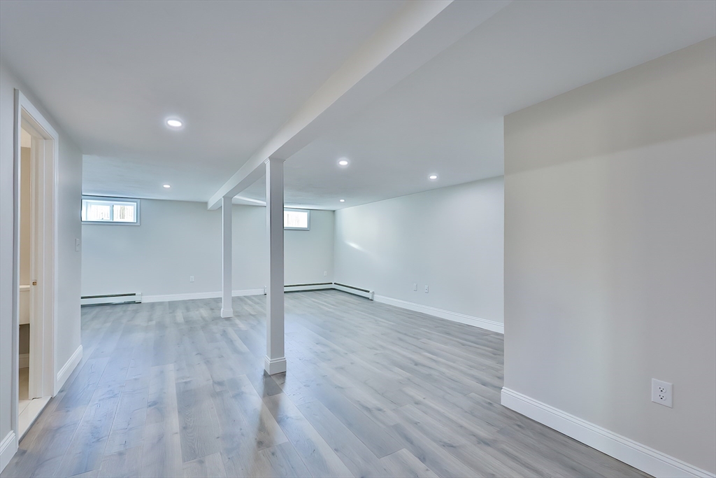 8 Dianthus Road Holbrook, MA 02343 - Photo 10 of 20 wooden floor in an empty room with wooden floor
