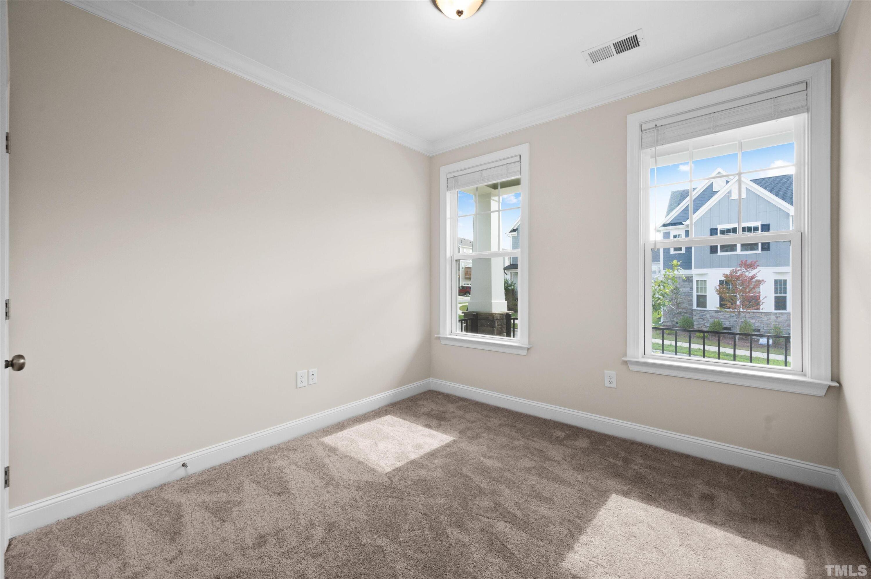 2917 Early Planting Avenue Apex, NC 27502 - Photo 17 of 41 an empty room with windows