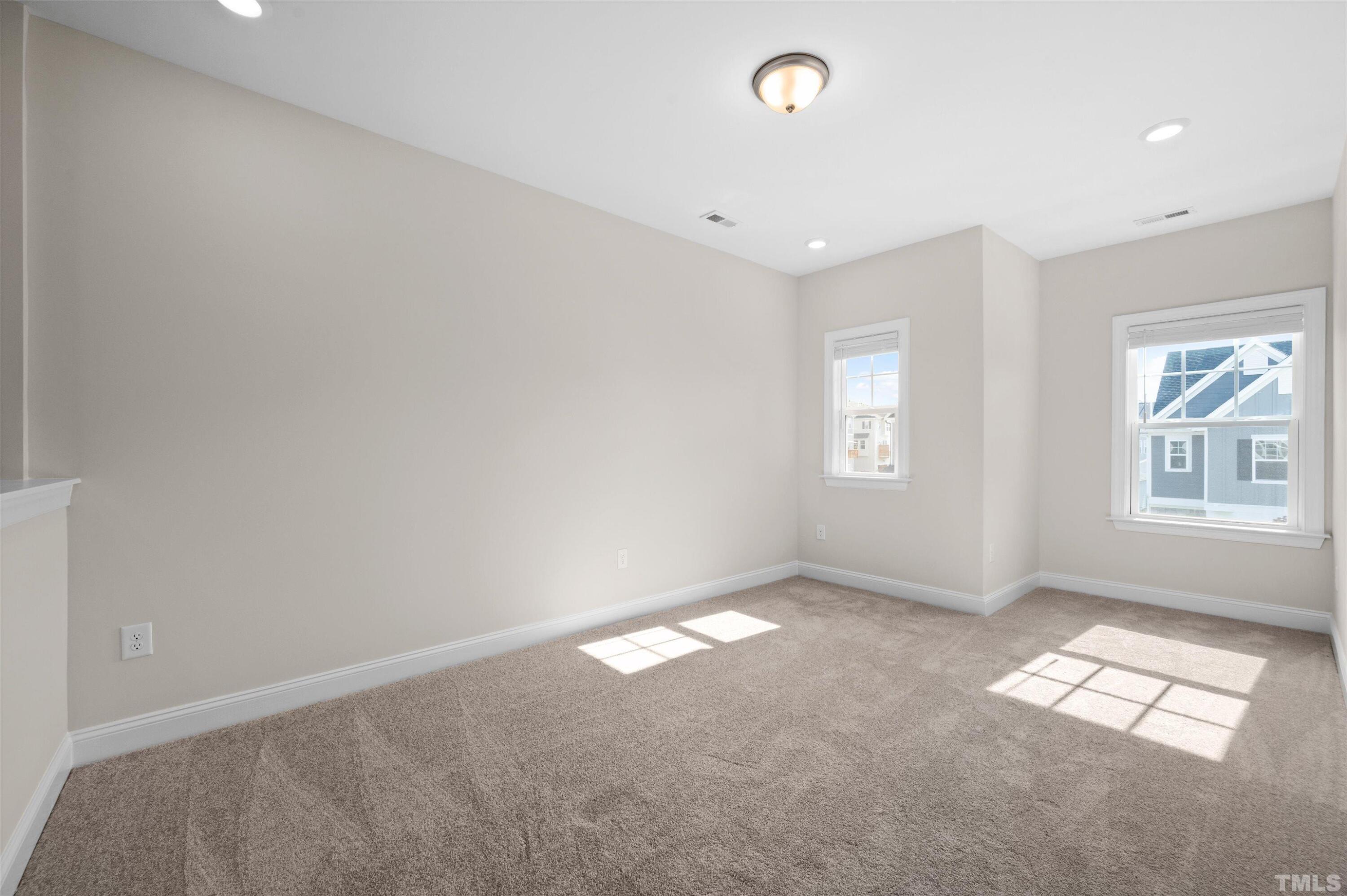 2917 Early Planting Avenue Apex, NC 27502 - Photo 22 of 41 an empty room with windows