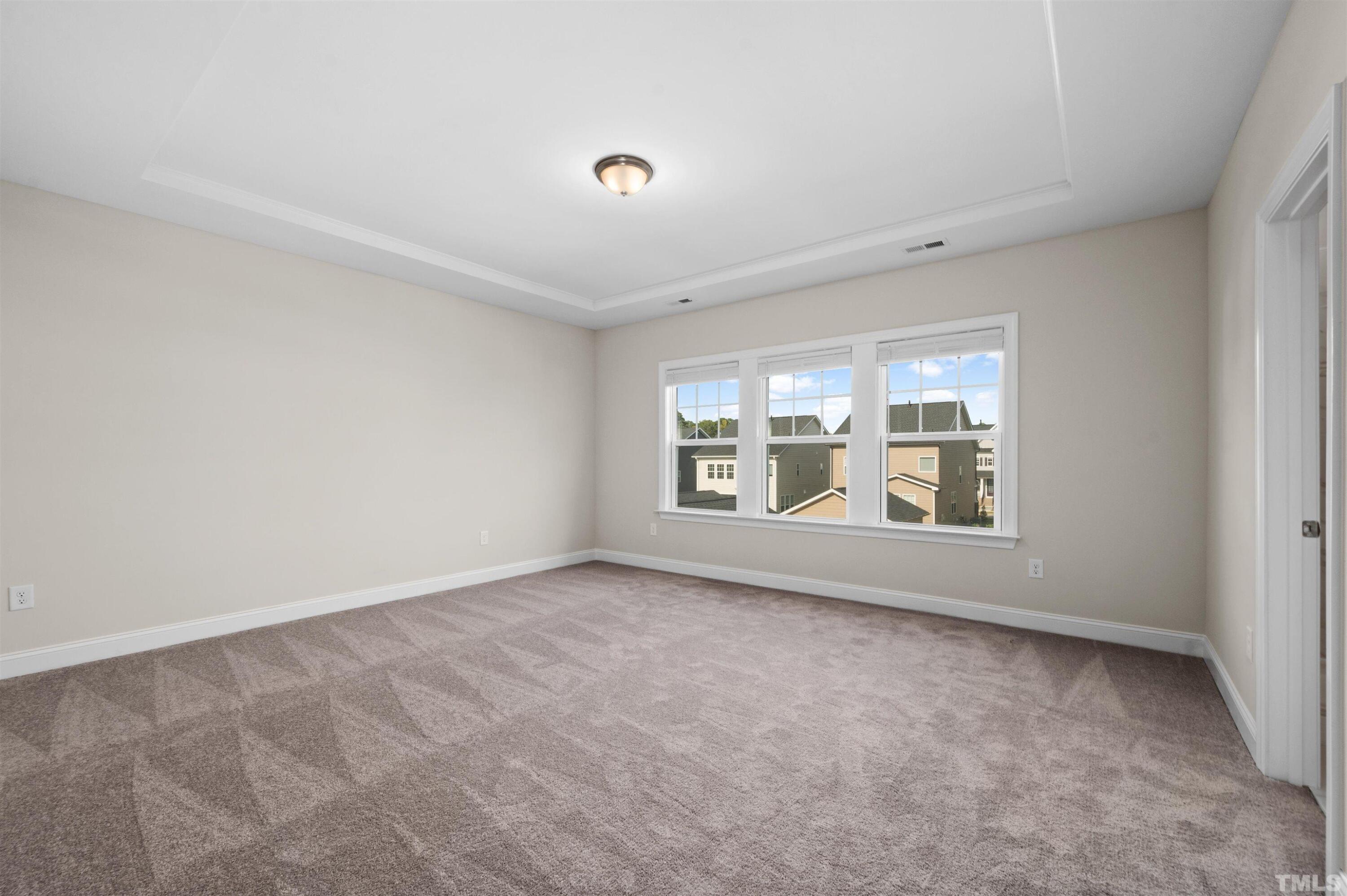 2917 Early Planting Avenue Apex, NC 27502 - Photo 24 of 41 a view of an empty room with a window