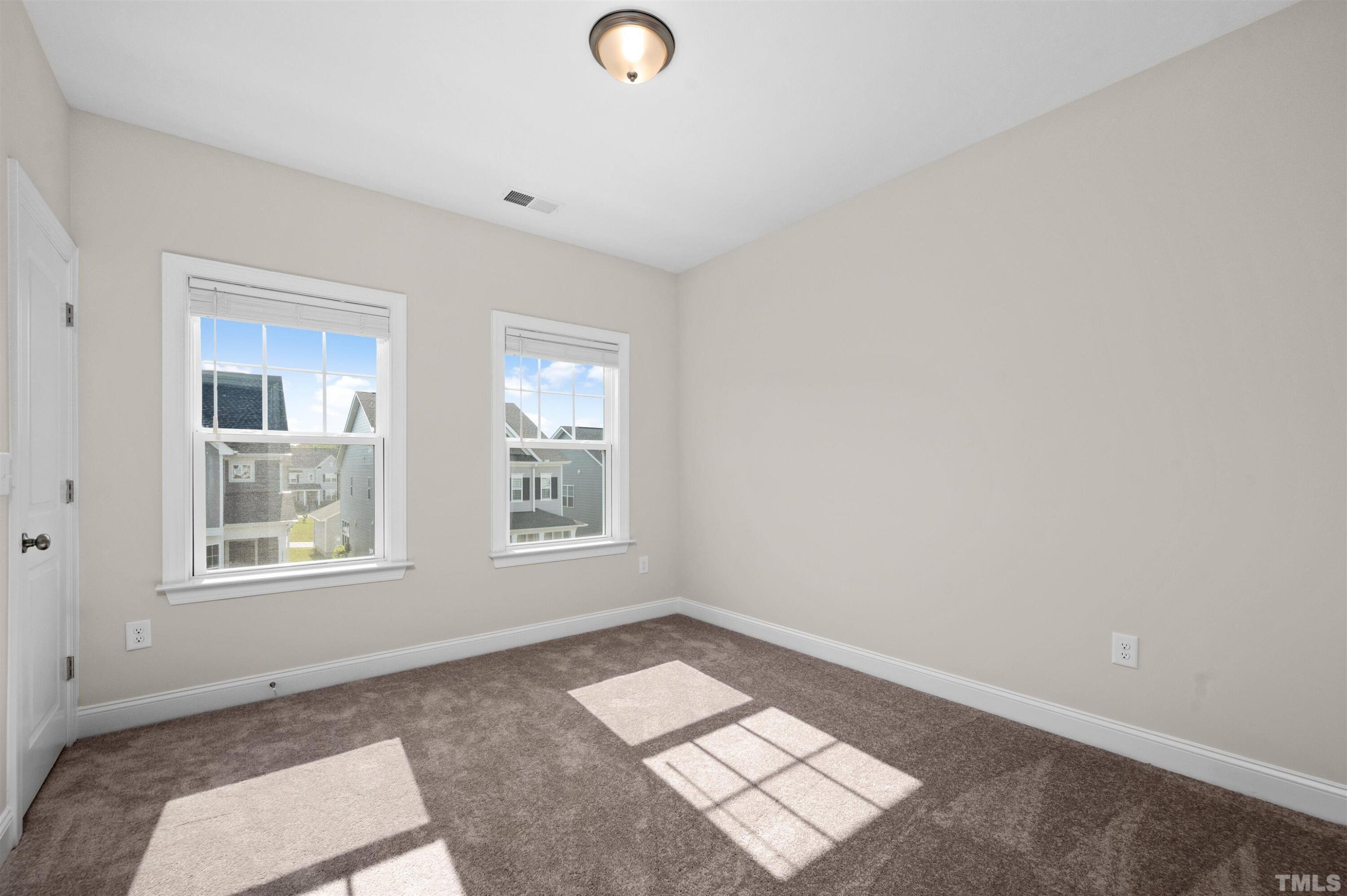 2917 Early Planting Avenue Apex, NC 27502 - Photo 29 of 41 an empty room with windows