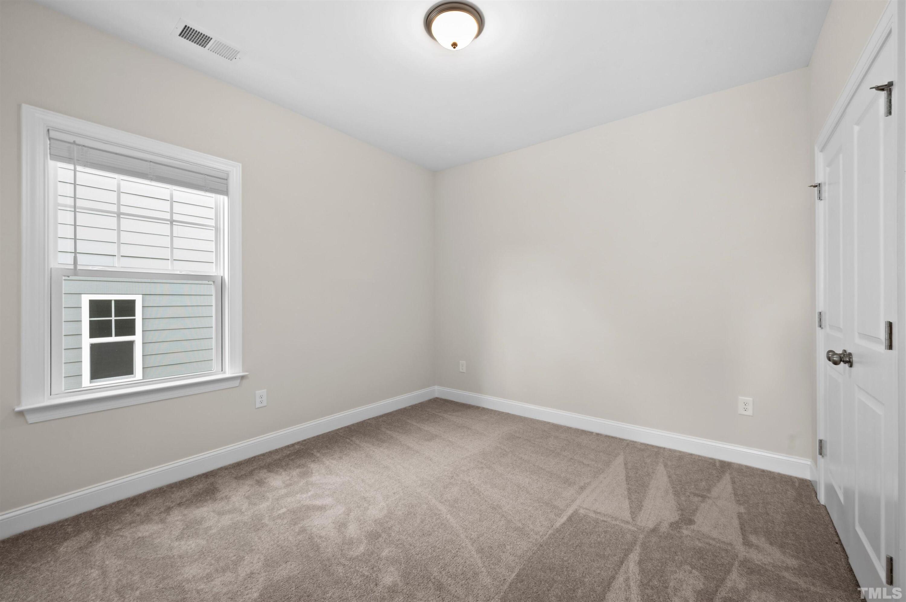 2917 Early Planting Avenue Apex, NC 27502 - Photo 32 of 41 an empty room with a window
