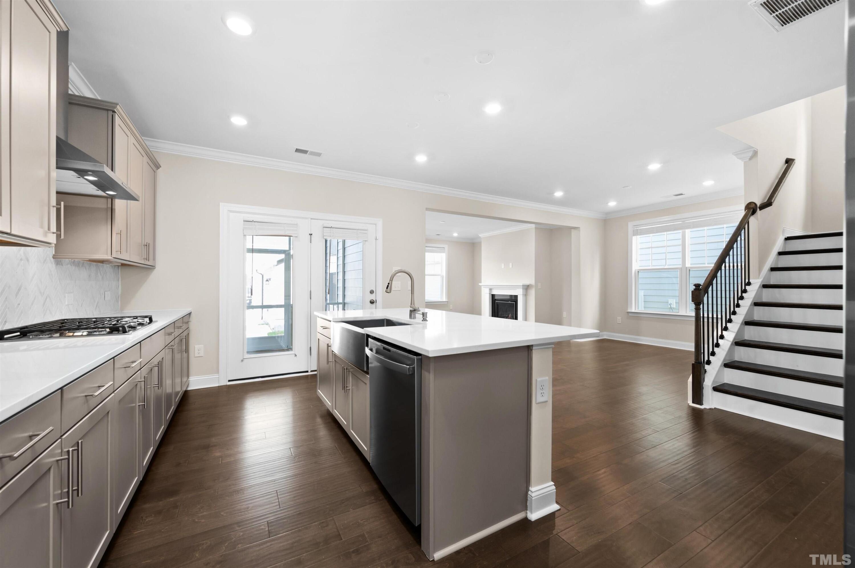 2917 Early Planting Avenue Apex, NC 27502 - Photo 10 of 41 a kitchen with wooden floor and electronic appliances