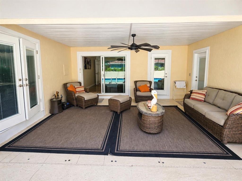 2313 Southeast 7th Street Ocala, FL 34471 - Photo 10 of 54 a living room with furniture and a chandelier